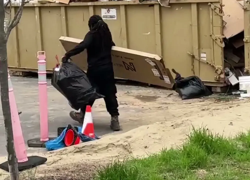 Ascent Cleaning Solutions team member loading construction debris on a Nashville job site